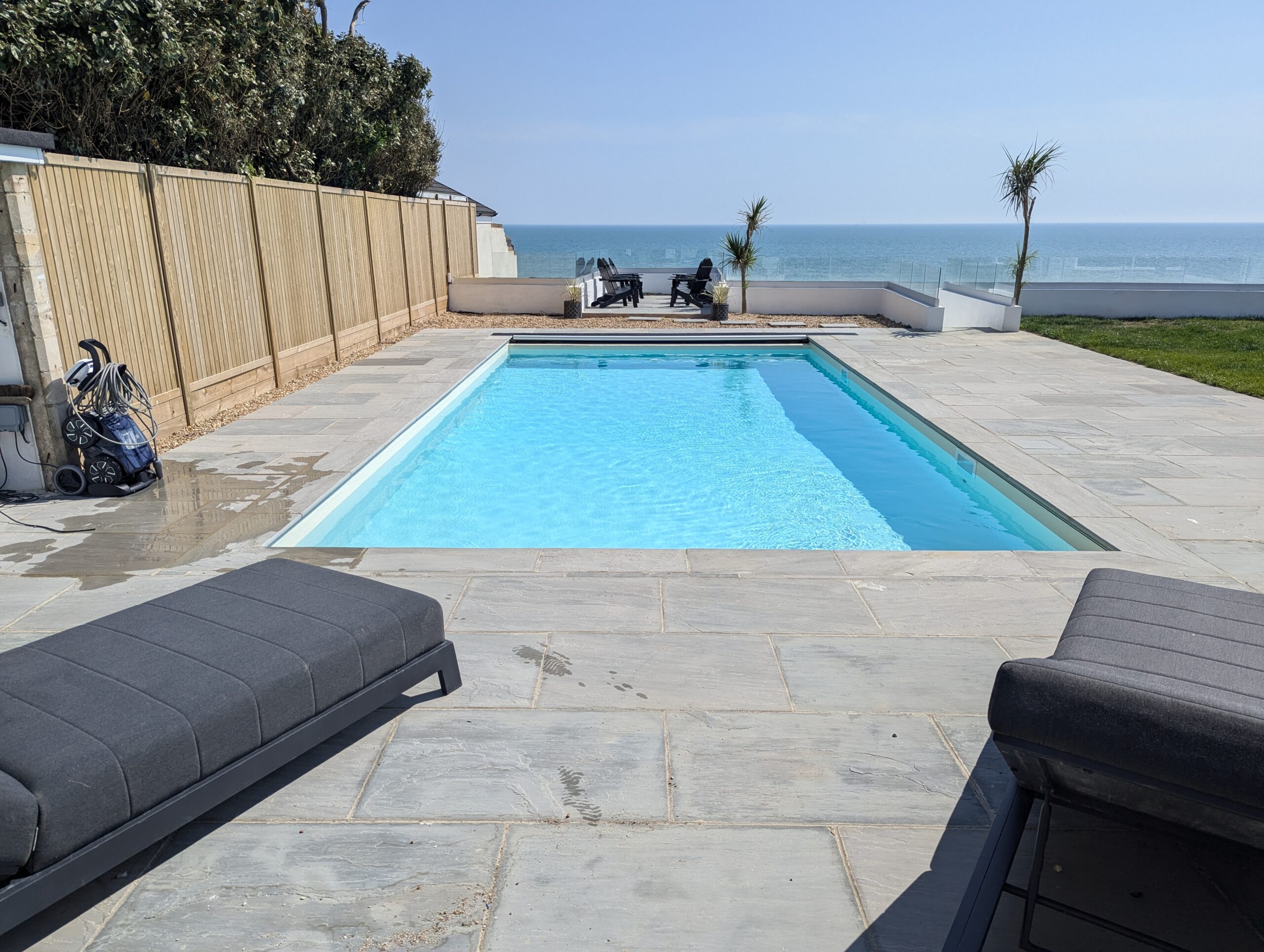 swimming pool overlooking a beach